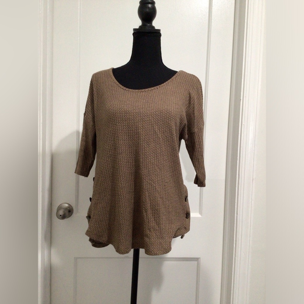 Brown knitted shirt with buttons on the side